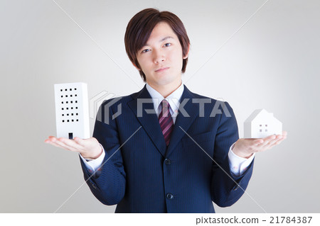 Male business man with apartment and house Living / Working vs Home 21784387