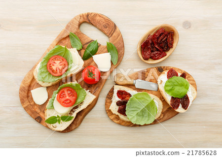 Sandwiches with mascarpone, dried tomatoes, basil 21785628