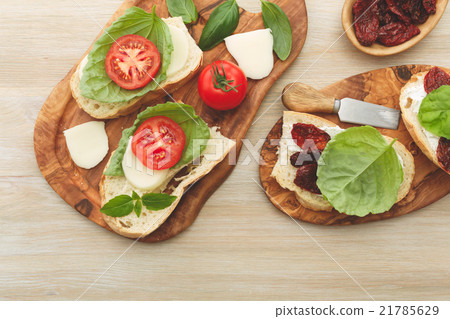 Sandwiches with mascarpone, dried tomatoes, basil 21785629