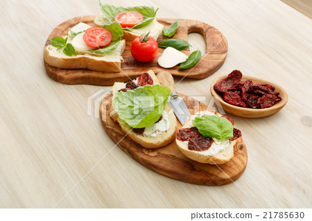Sandwiches with mascarpone, dried tomatoes, basil 21785630