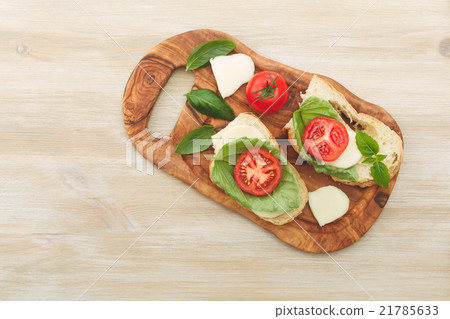 Sandwiches with mascarpone, dried tomatoes, basil 21785633