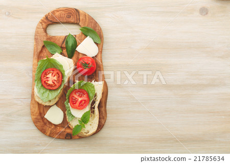 Sandwiches with mascarpone, dried tomatoes, basil 21785634