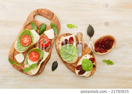 Sandwiches with mascarpone, dried tomatoes, basil 21785635