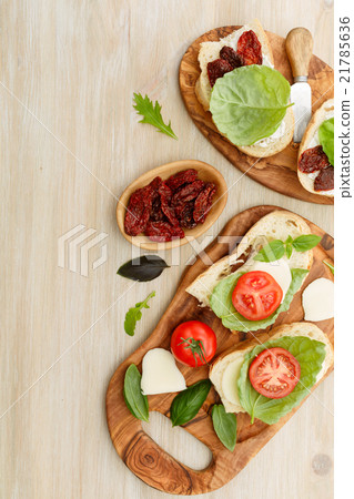 Sandwiches with mascarpone, dried tomatoes, basil 21785636