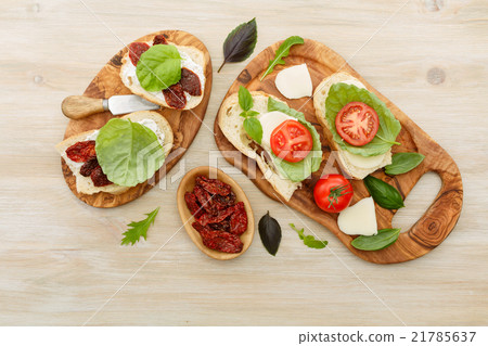 Sandwiches with mascarpone, dried tomatoes, basil 21785637