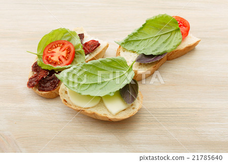 Sandwiches with mascarpone, dried tomatoes, basil 21785640