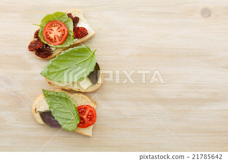Sandwiches with mascarpone, dried tomatoes, basil 21785642
