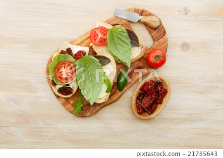 Sandwiches with mascarpone, dried tomatoes, basil 21785643