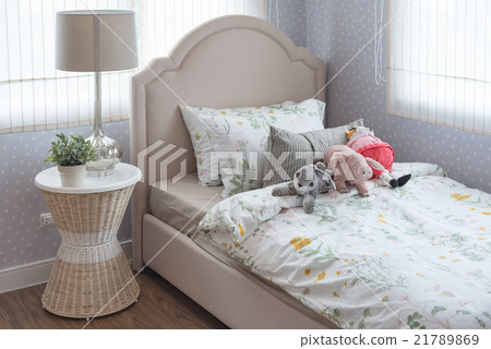 kid's bedroom with dolls on bed kid's bedroom with dolls on bed 21789869