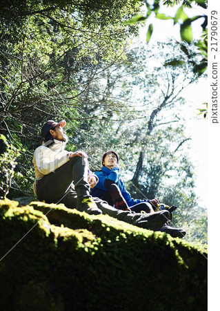 Men resting in the mountains 21790679