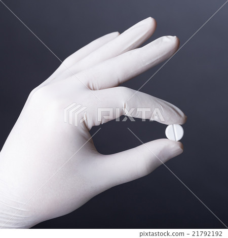 Hand with pill Hand with pill 21792192