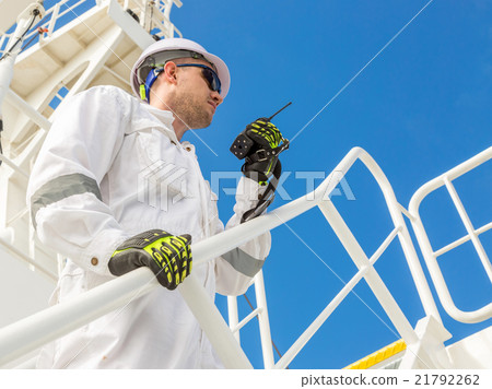 Engineer with VHF under blue sky 21792262