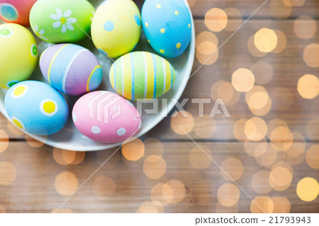 close up of colored easter eggs on plate close up of colored easter eggs on plate 21793943
