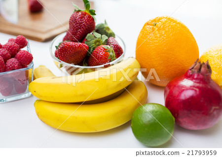 close up of fresh fruits and berries on table 21793959