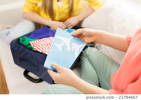 close up of women with tickets and travel bag close up of women with tickets and travel bag 21794667