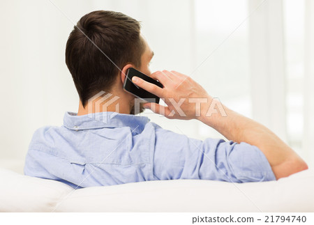 close up of man calling on smartphone at home close up of man calling on smartphone at home 21794740