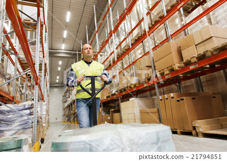 man carrying loader with goods at warehouse 21794851