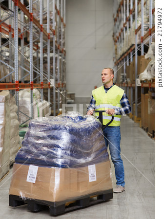 man carrying loader with goods at warehouse 21794972