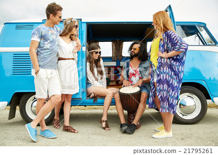 hippie friends with tom-tom playing music over car 21795261