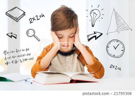 student boy reading book or textbook at home student boy reading book or textbook at home 21795306