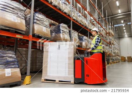 man on forklift loading cargo at warehouse man on forklift loading cargo at warehouse 21795934
