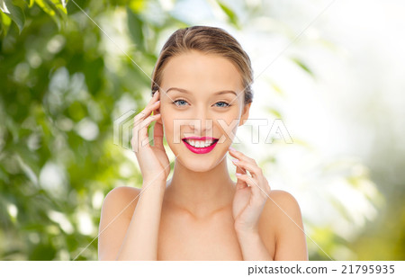 smiling young woman with pink lipstick on lips smiling young woman with pink lipstick on lips 21795935