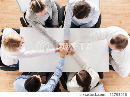 close up of business team with hands on top close up of business team with hands on top 21795936