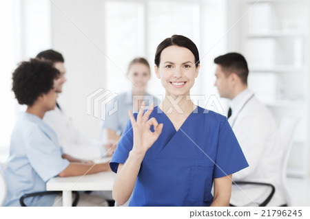 happy doctor over group of medics at hospital happy doctor over group of medics at hospital 21796245