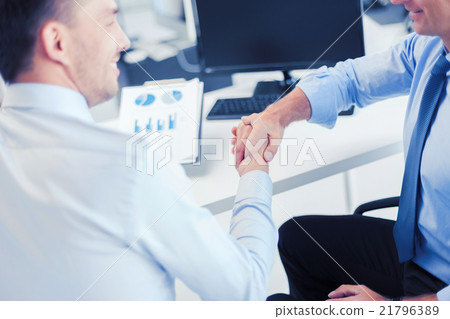 businessmen shaking hands in office businessmen shaking hands in office 21796389