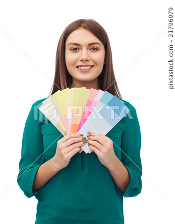 smiling young woman with color swatches smiling young woman with color swatches 21796979
