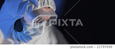 close up of scientist face in chemical lab 21797099