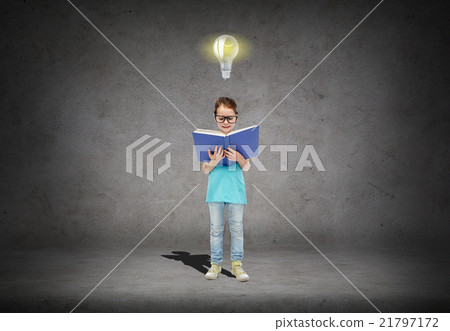 happy little girl in eyeglasses reading book happy little girl in eyeglasses reading book 21797172
