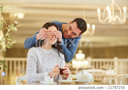 happy couple drinking tea at cafe happy couple drinking tea at cafe 21797250