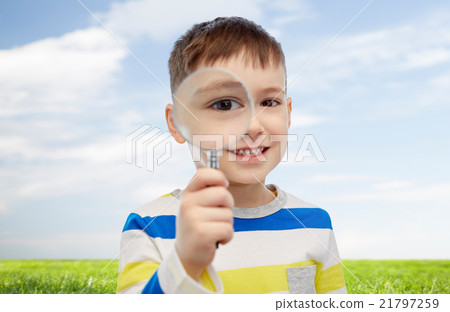 happy little boy looking through magnifying glass happy little boy looking through magnifying glass 21797259
