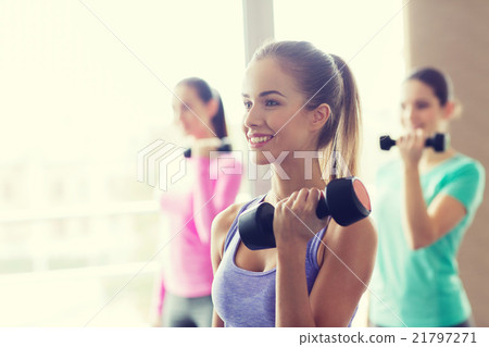 group of happy women with dumbbells in gym group of happy women with dumbbells in gym 21797271