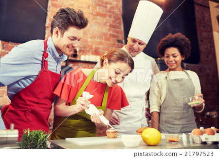 happy friends and chef cook baking in kitchen happy friends and chef cook baking in kitchen 21797523