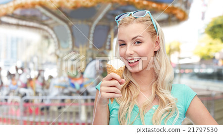 happy young woman in sunglasses eating ice cream 21797530