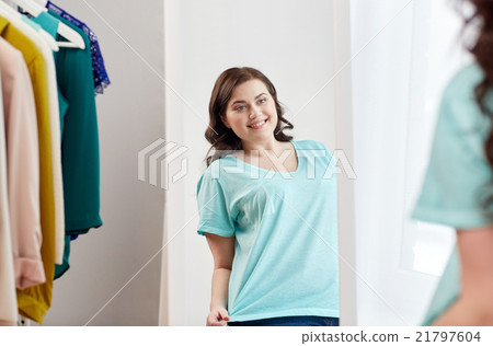 happy plus size woman posing at home mirror happy plus size woman posing at home mirror 21797604