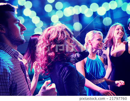 smiling friends dancing in club 21797760