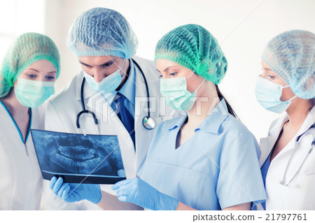 young group of doctors looking at x-ray 21797761