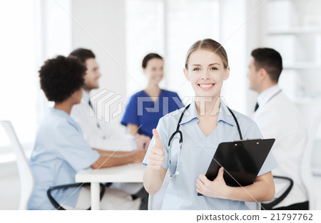 happy doctor over group of medics at hospital 21797762