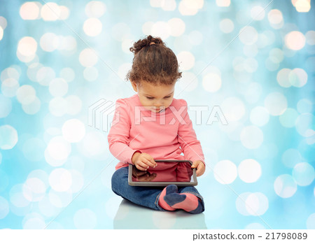 little baby girl playing with tablet pc computer little baby girl playing with tablet pc computer 21798089