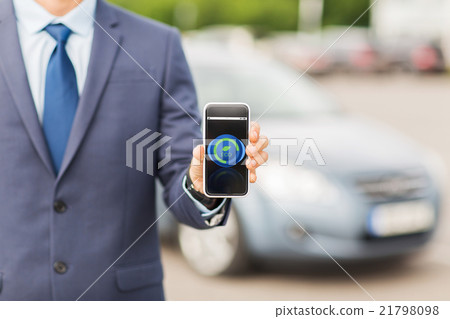 close up of business man with smartphone and car 21798098