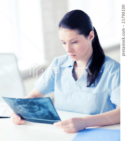 doctor or dentist looking at x-ray doctor or dentist looking at x-ray 21798100
