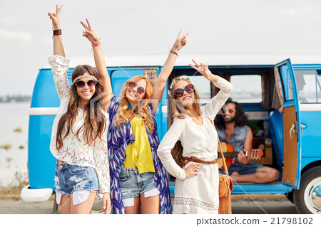 happy hippie friends having fun over minivan car happy hippie friends having fun over minivan car 21798102