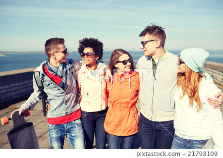 smiling friends in sunglasses laughing on street smiling friends in sunglasses laughing on street 21798109