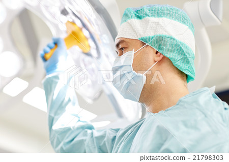 surgeon in operating room at hospital 21798303