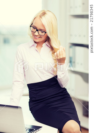 smiling businesswoman or student with laptop smiling businesswoman or student with laptop 21798345