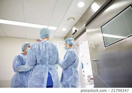 group of surgeons in operating room at hospital group of surgeons in operating room at hospital 21798347