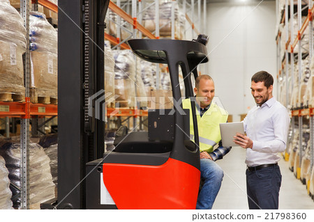 men with tablet pc and forklift at warehouse 21798360